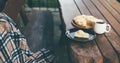 Fresh homemade peach pie and black tea on a cozy terrase.