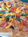 Fresh homemade pizza with yellow peppers