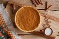 Fresh Homemade Pumpkin Pie made for Thanksgiving. Pie on a wooden background. Rustic.