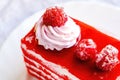 Fresh homemade Red Velvet cake decorated with whipped cream and raspberry berries Royalty Free Stock Photo