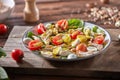 Fresh homemade salad with natural ingredients - organic clean vegetables, chicken meat and guail eggs, spicy mustard in Royalty Free Stock Photo