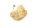 Fresh homemade slice of whole wheat bread broken into two halves with falling seed down. Royalty Free Stock Photo
