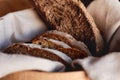Fresh homemade slices of black rye bread in basket Royalty Free Stock Photo