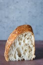 Fresh homemade sourdough bread with whole grain flour on a on a brown background. Royalty Free Stock Photo