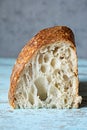 Fresh homemade sourdough bread with whole grain flour on a gray-blue background. Royalty Free Stock Photo