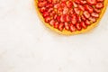 Fresh homemade strawberry shortcrust tart pie stuffed with custard vanilla cream . Sliced berries and mint leaf on the trendy Royalty Free Stock Photo