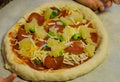 Fresh homemade unbaked pizza with toppings Royalty Free Stock Photo