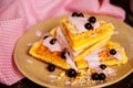 Fresh homemade Viennese waffles, drenched with yogurt and berries Royalty Free Stock Photo