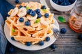 Fresh homemade waffles with blueberries and banana for breakfast Royalty Free Stock Photo