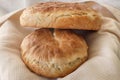 Fresh homemade wheat bread on wooden table