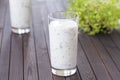 Fresh homemade yogurt kefir, ayran in glass with herbs. Ayran, homemade yogurt drink with herbs and cucumbers - healthy summer