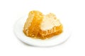 Fresh honey / Close up of yellow sweet honeycomb slice white plate natural healthy food Royalty Free Stock Photo