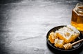 Fresh honey comb in an old pan. Royalty Free Stock Photo