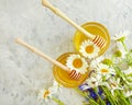 Fresh honey, daisy flower health dessert vitamin cornflower on gray concrete gray background organic