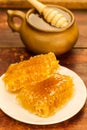 Fresh honey and drizzler on a wooden background. Autumn style