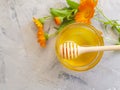 Fresh honey flower sweet composition natural organic delicious calendula on a gray concrete background