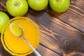 Fresh honey in glass bowl and green apples on table with copy space Royalty Free Stock Photo