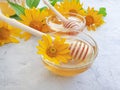 Fresh honey sweet nutrition flower calendula breakfast on concrete background Royalty Free Stock Photo