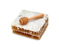 Fresh Honeycomb slice and wooden honey dipper isolated on white background Royalty Free Stock Photo