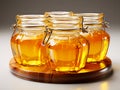 Fresh honeycombs in glass jar. Liquid honey with honeycomb and honey dipper in glass jug Royalty Free Stock Photo