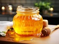 Fresh honeycombs in glass jar. Liquid honey with honeycomb and honey dipper in glass jug Royalty Free Stock Photo