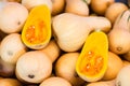 Fresh Honeynut Butternut Squash at a produce stand. Raw Orange Organic Butternut Squash Ready to Bake. Butternut Squash textured