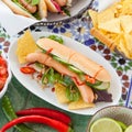 Fresh hot dogs with tortilla chips