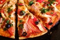 Fresh hot homemade pizza with chicken meat, ham, tomato, mozzarella cheese, black olives and parsley, top view Royalty Free Stock Photo