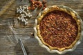 Fresh hot pecan pie served on a rustic table top