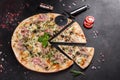 Fresh hot pizza with bacon, onions, greens and tomatoes made in an oven Royalty Free Stock Photo