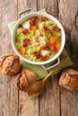 Fresh hot savoy cabbage soup with vegetables and fried bacon closeup in a bowl. Vertical top view Royalty Free Stock Photo