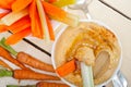 Fresh hummus dip with raw carrot and celery Royalty Free Stock Photo