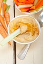 Fresh hummus dip with raw carrot and celery Royalty Free Stock Photo