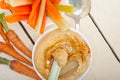 Fresh hummus dip with raw carrot and celery Royalty Free Stock Photo