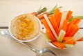 Fresh hummus dip with raw carrot and celery Royalty Free Stock Photo