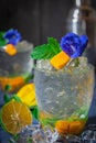 Fresh Ice mango soda drink decorate by Blue Butterfly Pea Flower and mint on the wood table there are mango slice, ice, lemon, Royalty Free Stock Photo