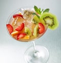 Fresh iced cocktail with fruits