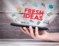 Fresh Ideas. Tablet computer in the hand. Old wooden background Royalty Free Stock Photo