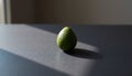 Single Green Avocado Seed on Slate Royalty Free Stock Photo