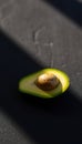 Single Green Avocado Seed on Slate Royalty Free Stock Photo