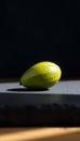 Single Green Avocado Seed on Slate Royalty Free Stock Photo