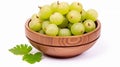 Fresh Indian gooseberry fruits in wooden bowl with green leaves on white background. generative ai Royalty Free Stock Photo