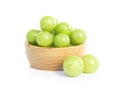 Fresh indian gooseberry in wooden bowl isolated on white background, herb and medical fruit for health care concept Royalty Free Stock Photo