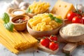 Fresh ingredients for a delicious pasta dish with cheese and tomatoes in a kitchen setting Royalty Free Stock Photo