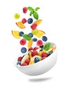 Fresh ingredients for fruit salad falling into bowl on background Royalty Free Stock Photo