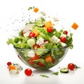 Fresh ingredients for Greek salad falling into bowl on white background Royalty Free Stock Photo