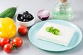 Fresh ingredients for homemade Greek salad on the table. Domestic life. Close-up Royalty Free Stock Photo