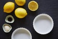 Fresh ingredients for lemon pie foodie baking on slate countertop