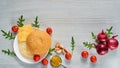 Fresh ingredients for vegetarian burger isolated on gray concrete background with free copy space: cherry tomatoes, rucola, onion