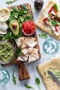 Fresh ingredients on a wooden board for making pesto deli turkey wraps. Royalty Free Stock Photo